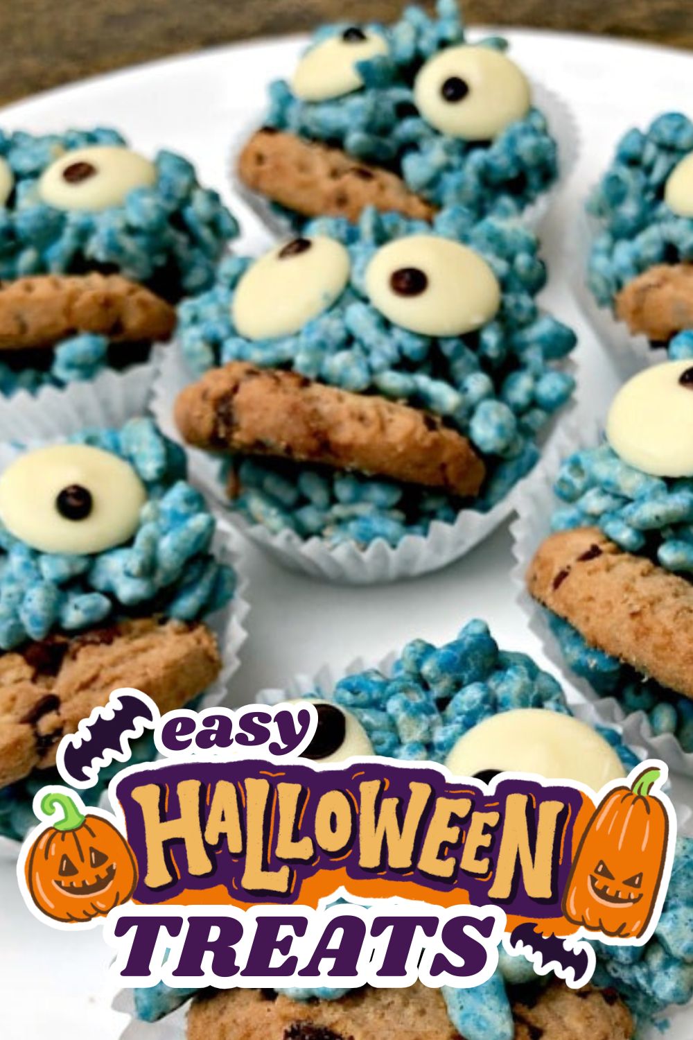 Festive Halloween cupcakes decorated with cookie eyes and blue sprinkles.