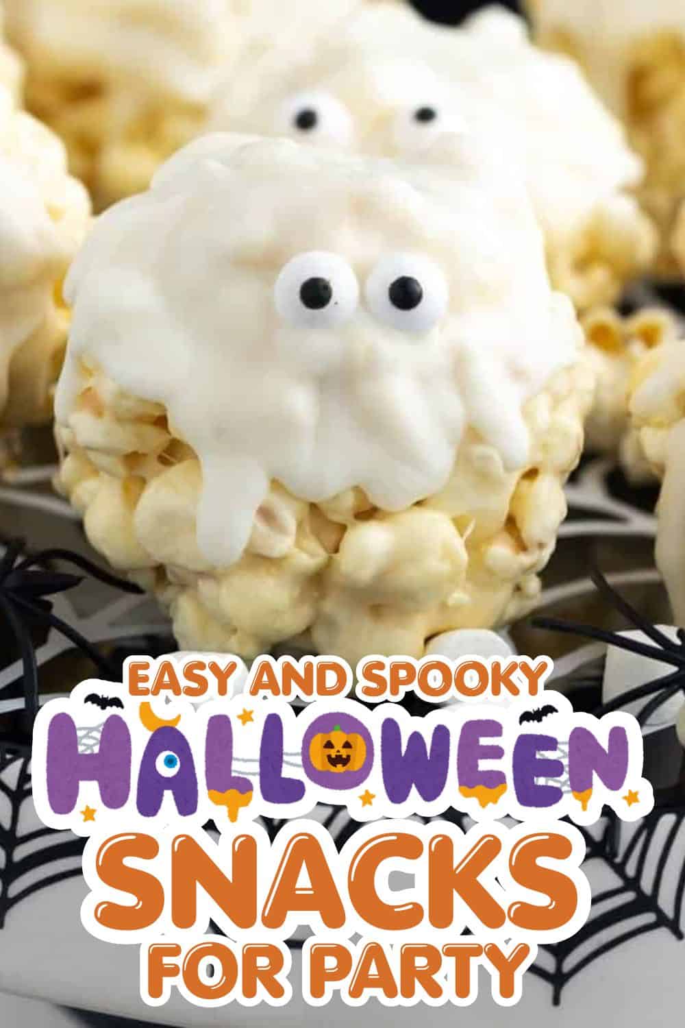 Spooky Halloween-themed cheese ball with googly eyes for party snacks.
