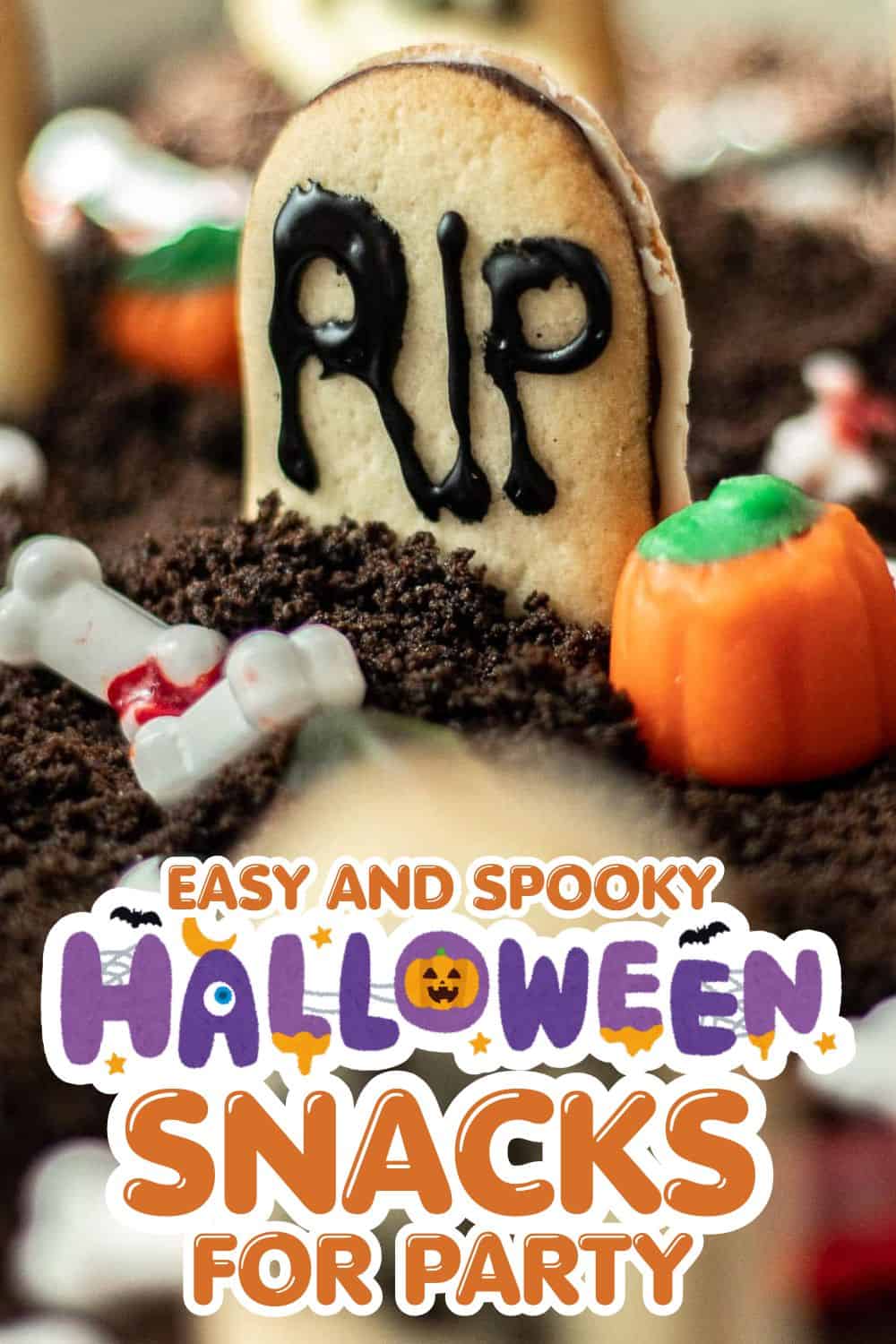 Spooky Halloween-themed cookies and candies for a festive party display.