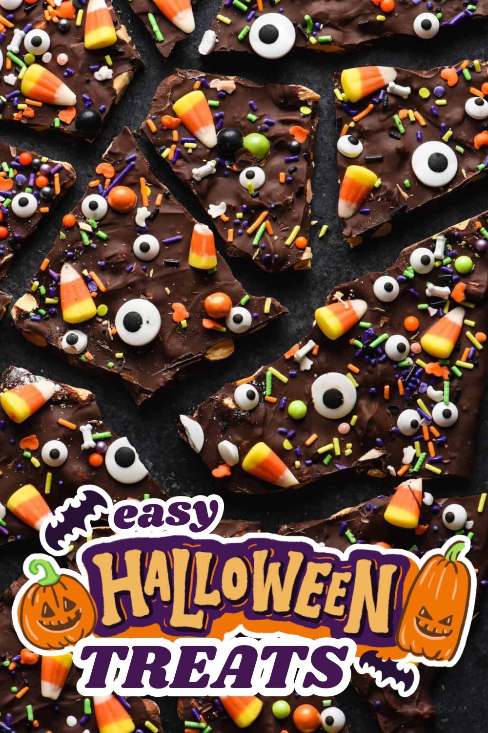 Chocolate Halloween treats decorated with candy corn, sprinkles, and eyeball candies for Halloween.
