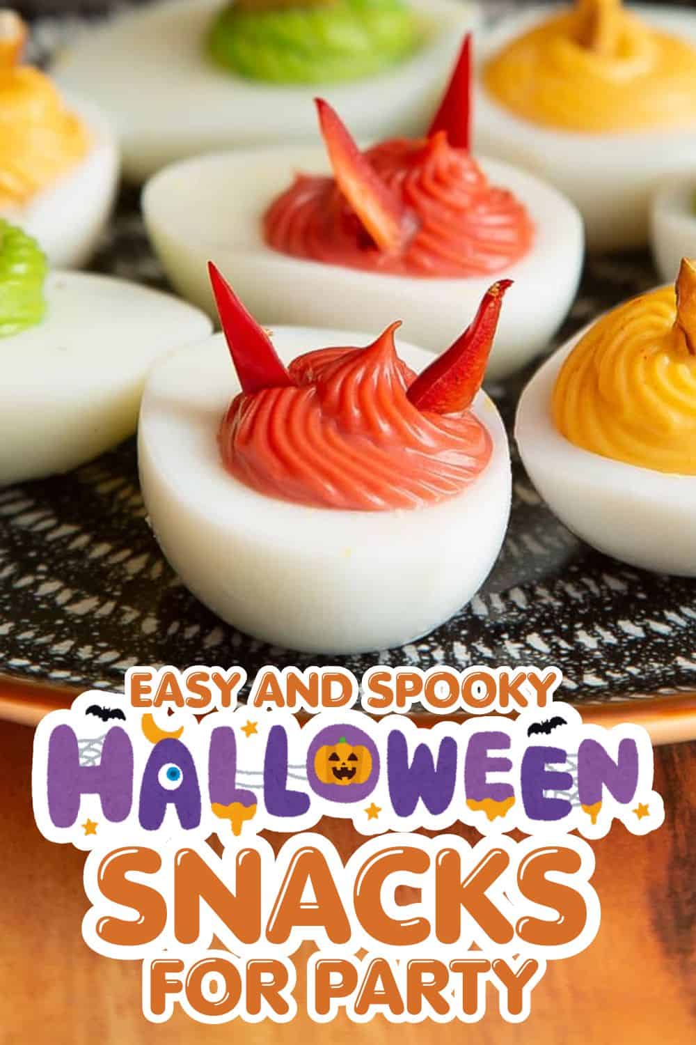 Halloween deviled eggs with red and yellow spicy toppings for spooky party snacks.