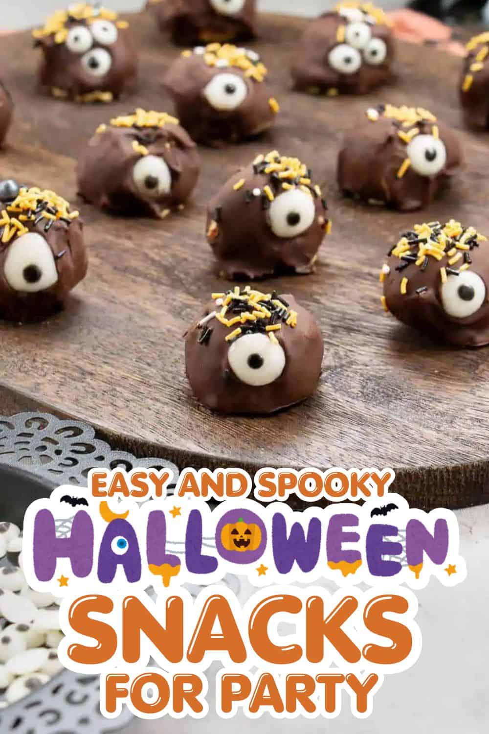Fun Halloween chocolate eyeball treats with sprinkles on a wooden surface for spooky parties.