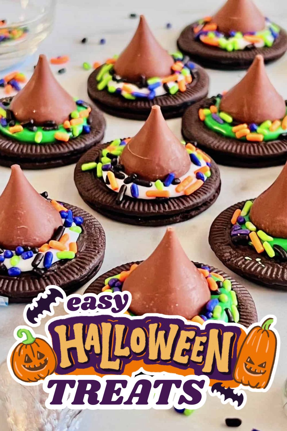 Chocolate cookies with colorful sprinkles and chocolate cone hats for Halloween.