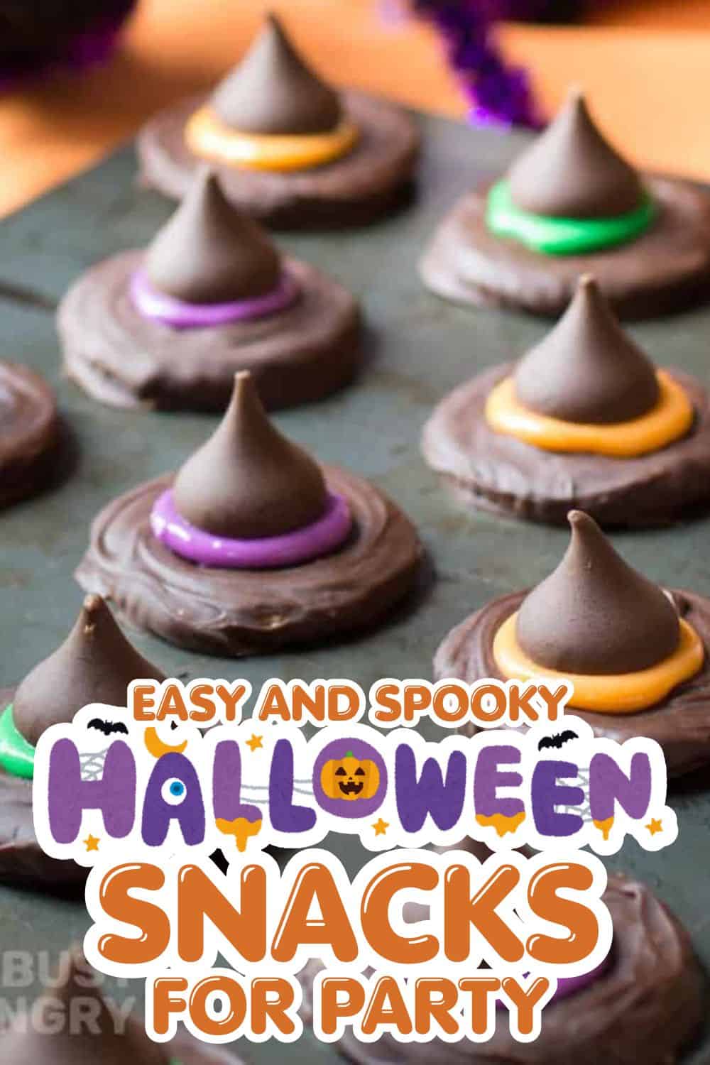 Chocolate Halloween cookies with colorful icing and spooky decorations.