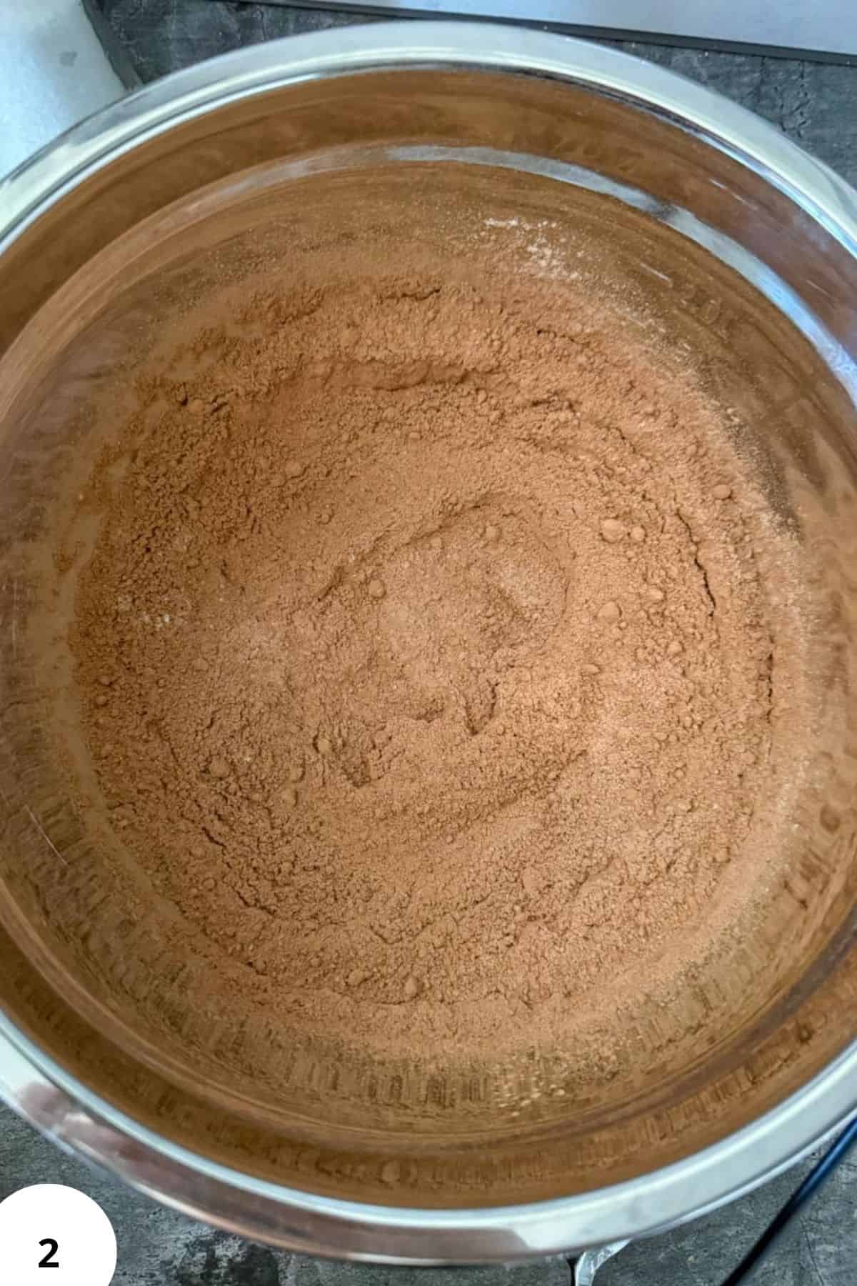 Dough during stretch and fold process in mixing bowl for bread baking.