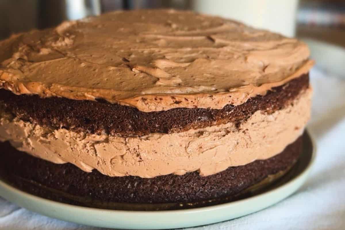 Chocolate cake with smooth frosting and layered texture.