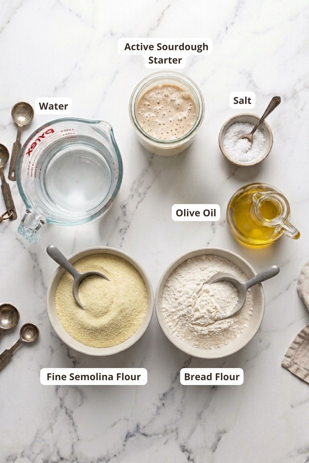 Sourdough starter ingredients with flour, water, salt, and olive oil.