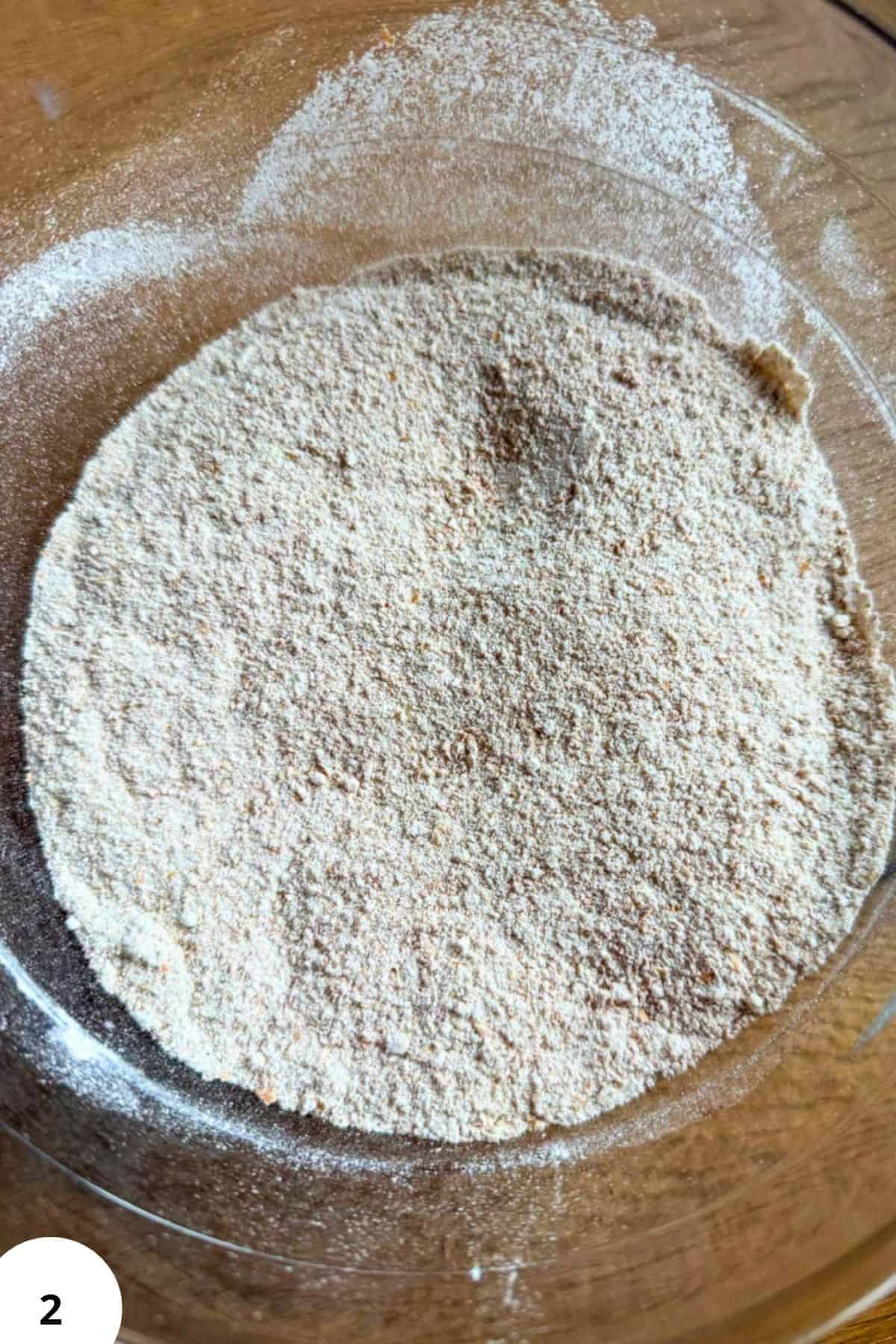 Close-up of freshly milled flour in a glass bowl for baking.