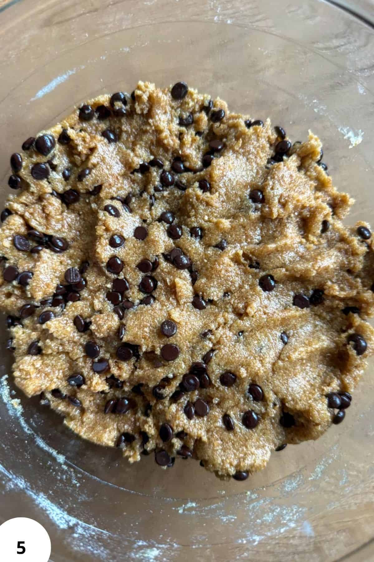 Cookie dough with chocolate chips ready for baking.
