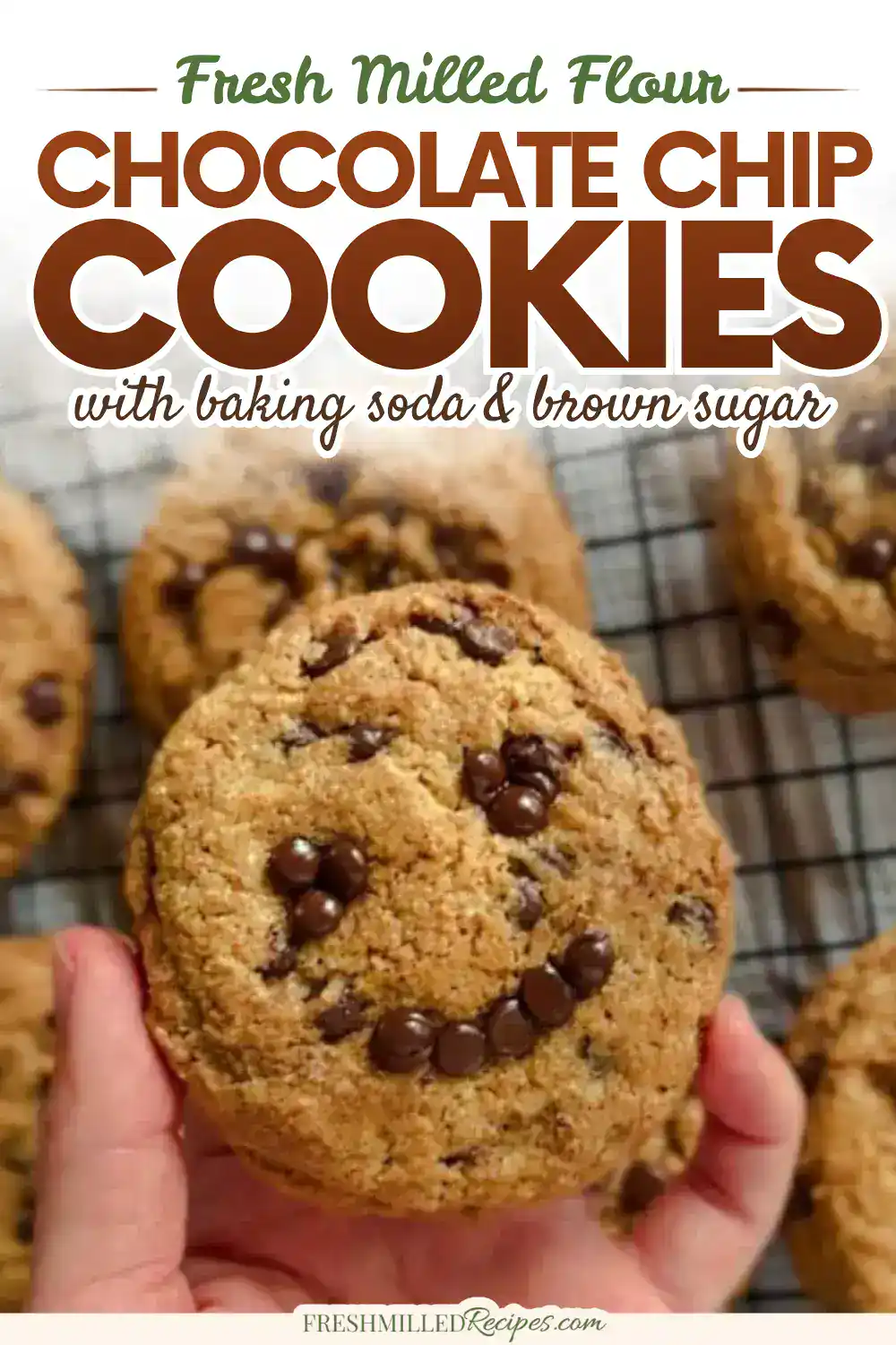 Close-up of a chocolate chip cookie with a smiley face made of chocolate chips.