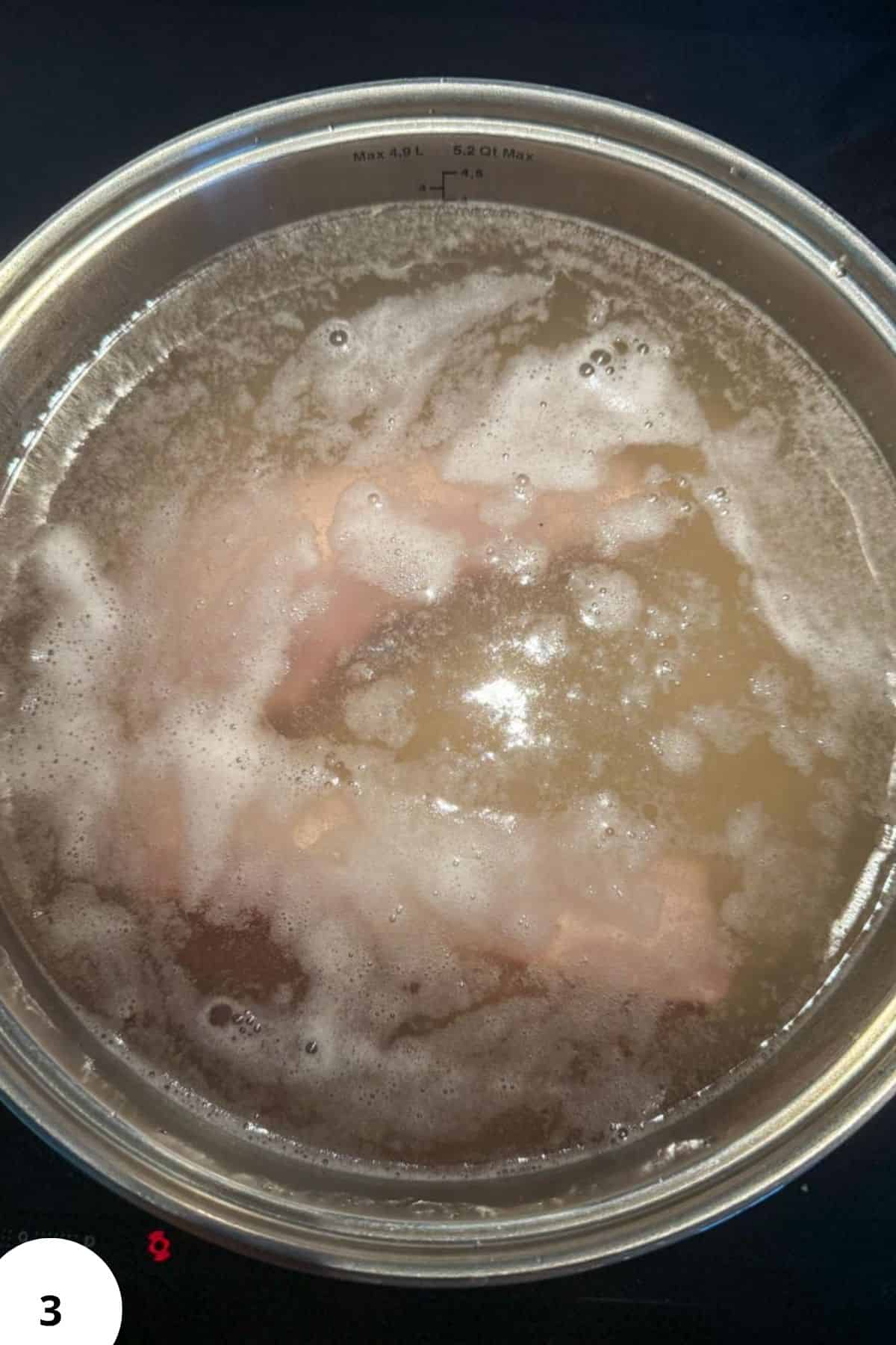 Boiling barley and beans for traditional Ričet stew.