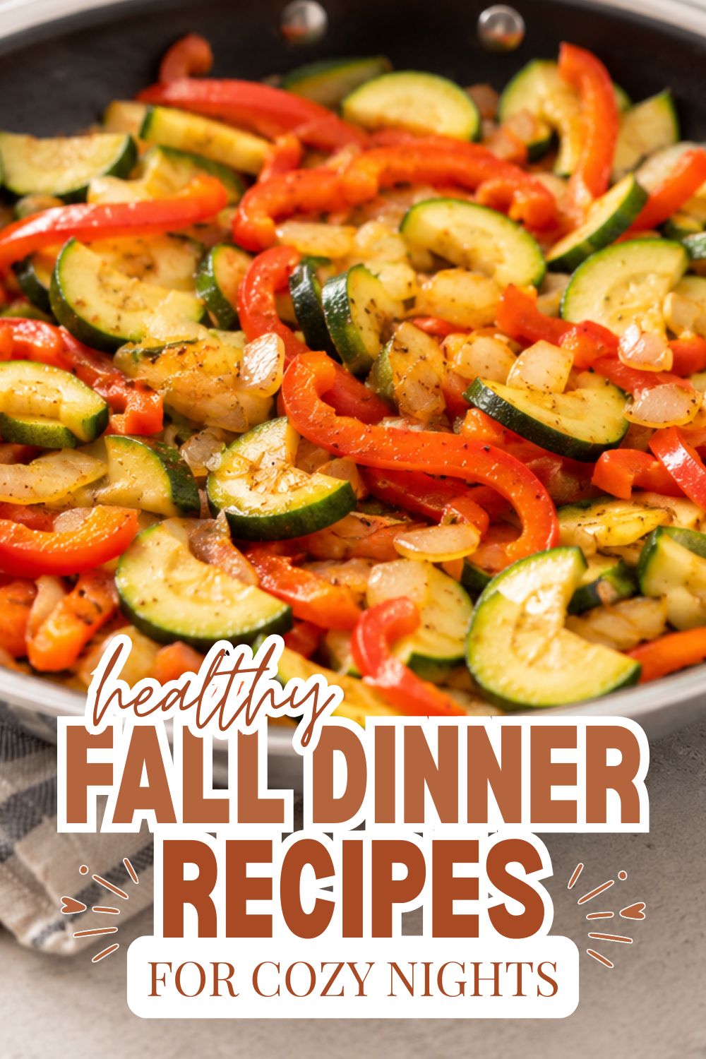 Colorful roasted vegetable medley with zucchini, red peppers, and onions for healthy fall dinners.