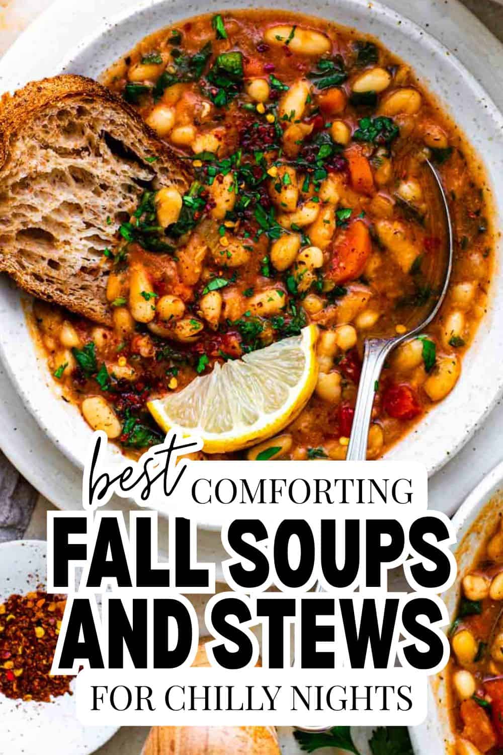 Hearty fall soups and stews with vegetables and beans in a white bowl with lemon wedge.