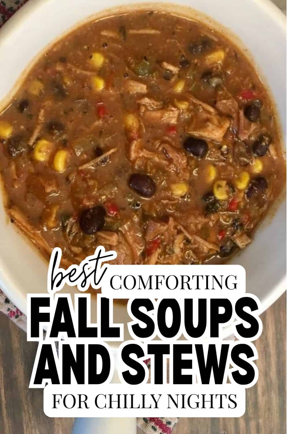 Hearty fall soups and stews in a white bowl with vegetables and meat.