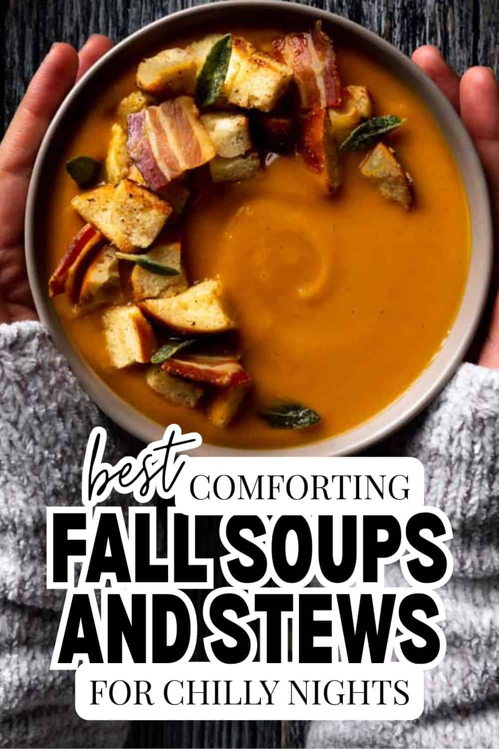 Bowl of pumpkin soup with bread cubes and vegetables for fall comfort food.