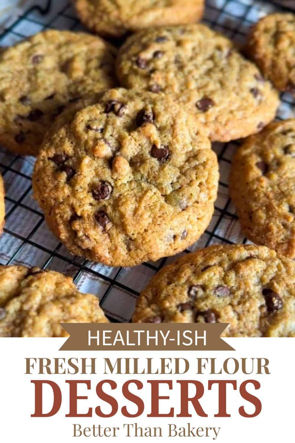 Freshly baked cookies with chocolate chips on a cooling rack, highlighting healthy, homemade dessert.
