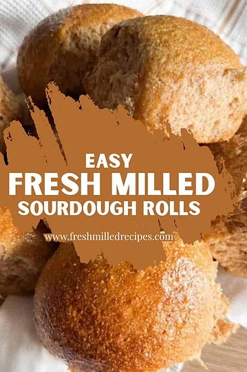 Close-up of freshly baked sourdough rolls with a golden crust.