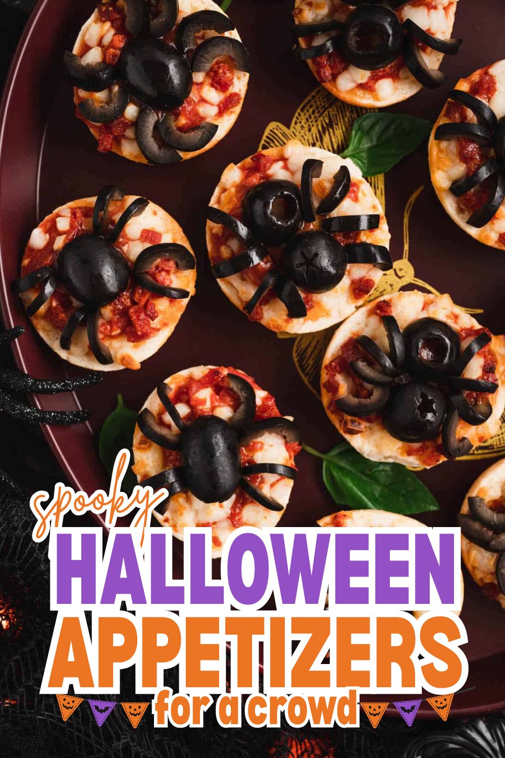 Spooky Halloween appetizers with olives, cheese, and toppings for a festive party.