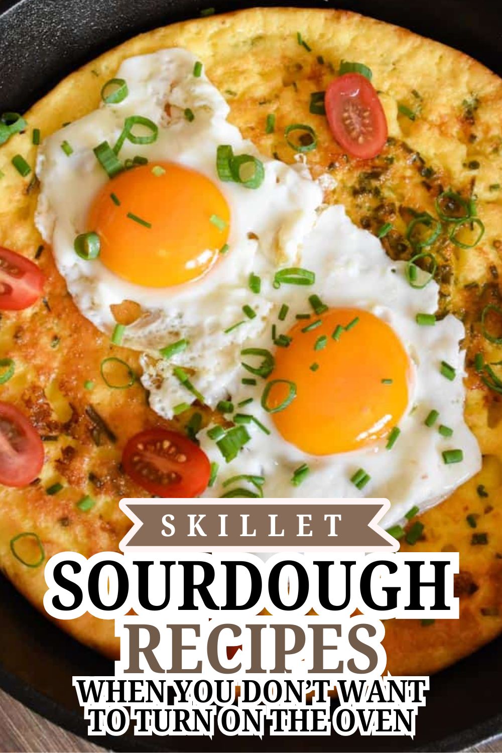 Delicious skillet sourdough with eggs, cherry tomatoes, and green onions.