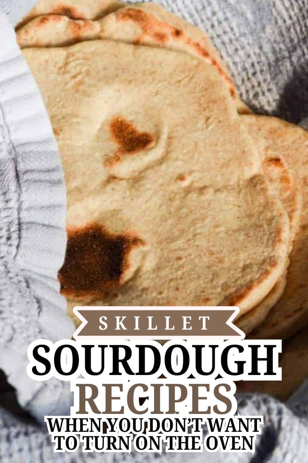 Close-up of freshly baked skillet sourdough bread with a golden crust.