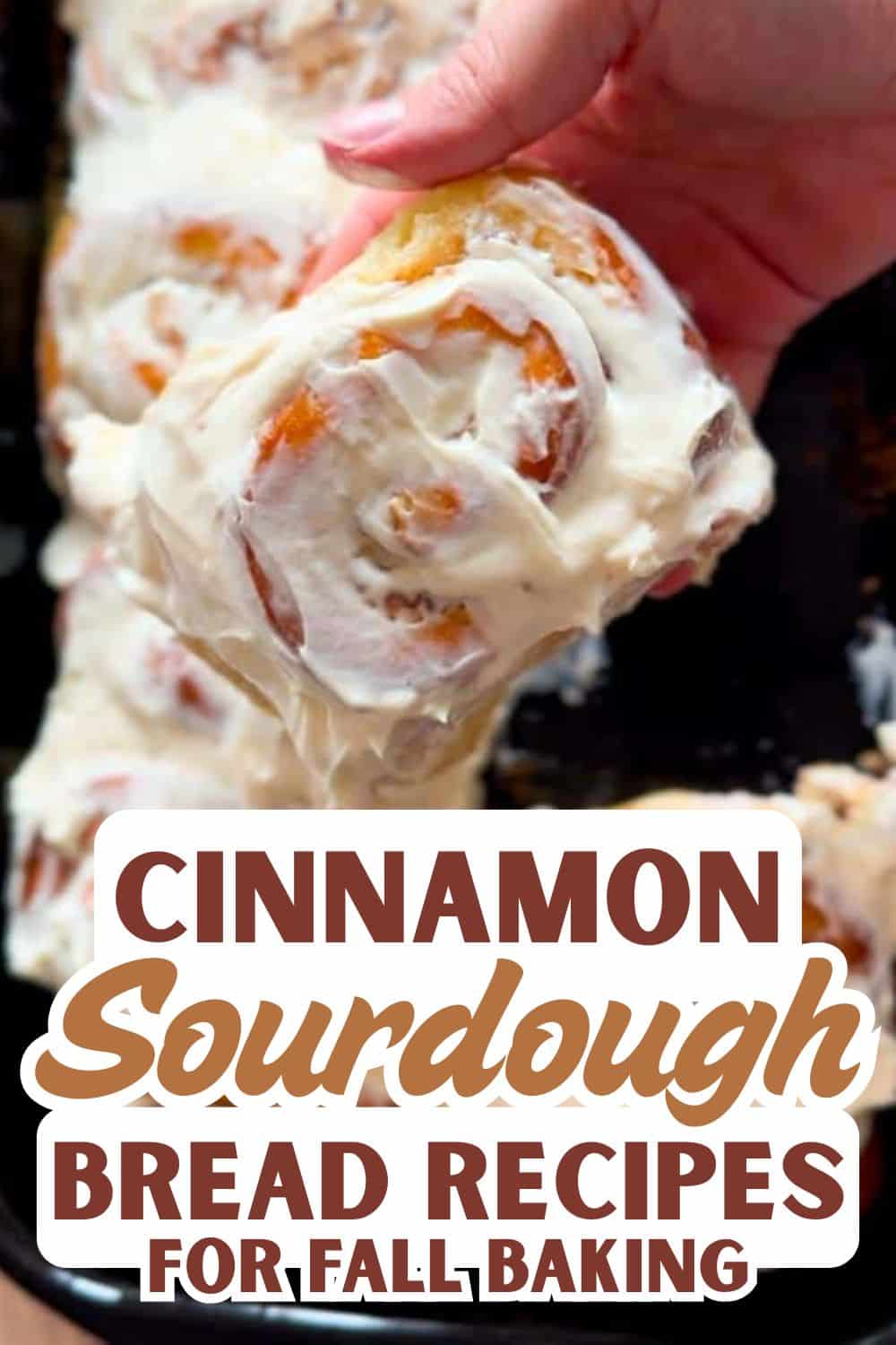 Close-up of cinnamon sourdough bread roll with creamy glaze.