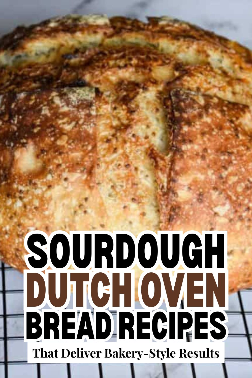Freshly baked sourdough bread with a golden crust on a cooling rack.