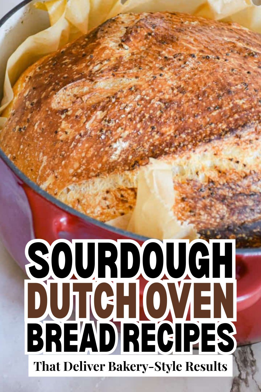 Freshly baked sourdough bread in a Dutch oven with a golden crust.