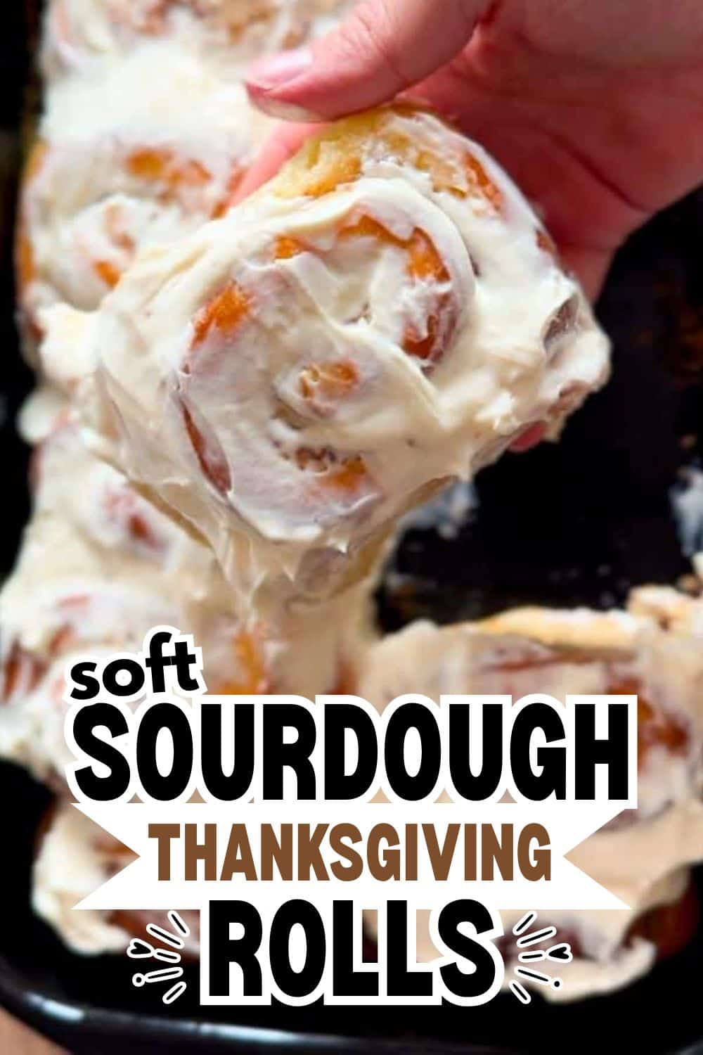 Close-up of soft sourdough Thanksgiving rolls with creamy glaze.