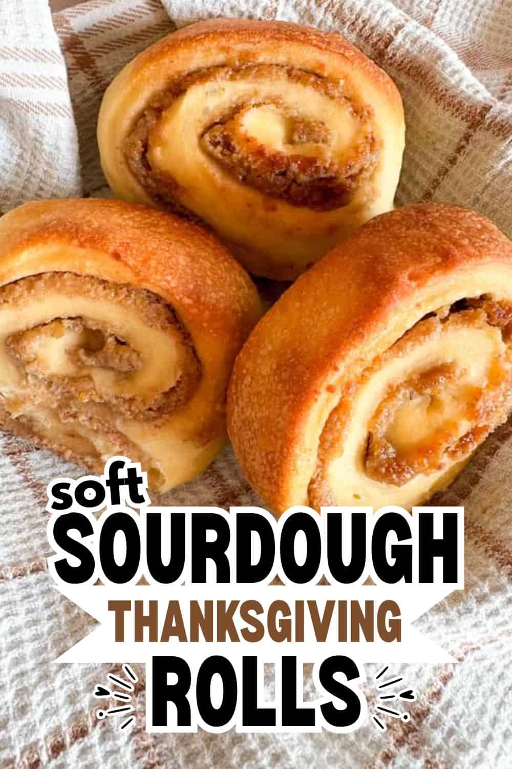 Close-up of freshly baked sourdough Thanksgiving rolls with swirled filling.