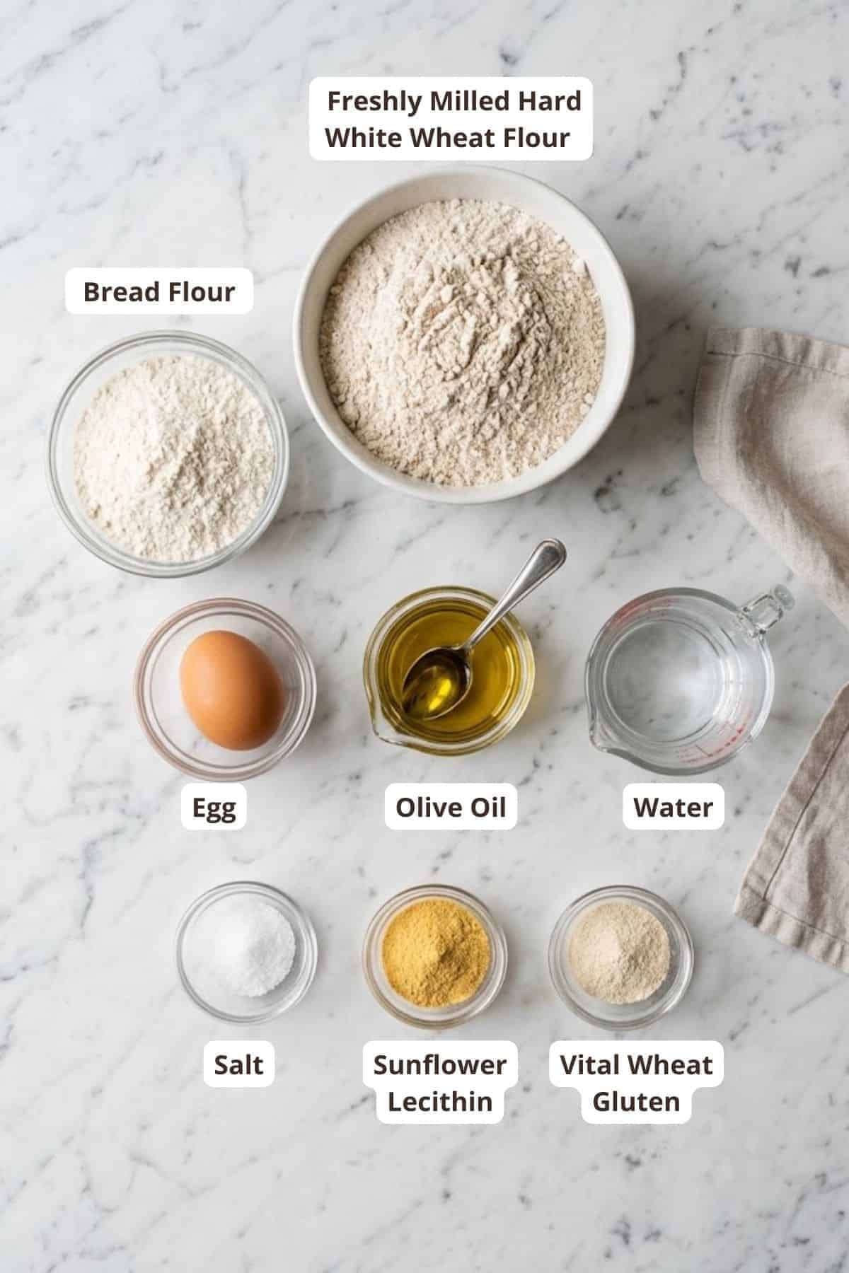 Ingredients for bread baking including flour, egg, olive oil, water, salt, lecithin, gluten.