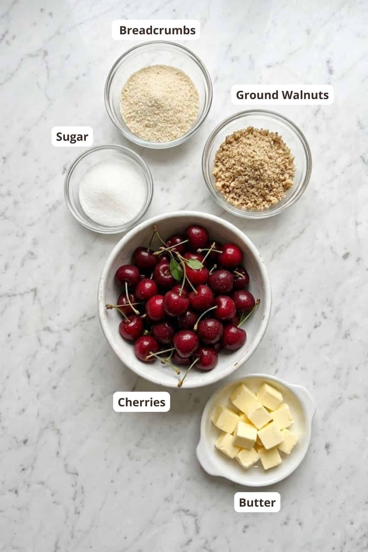 Cherries, breadcrumbs, ground walnuts, sugar, butter for cherry strudel.