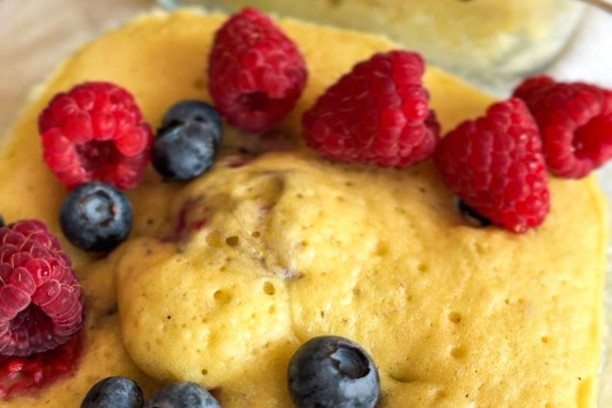 Close-up of sourdough discard pancake bowls topped with fresh berries.