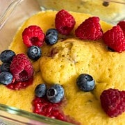 Close-up of sourdough discard pancake bowls topped with raspberries and blueberries.