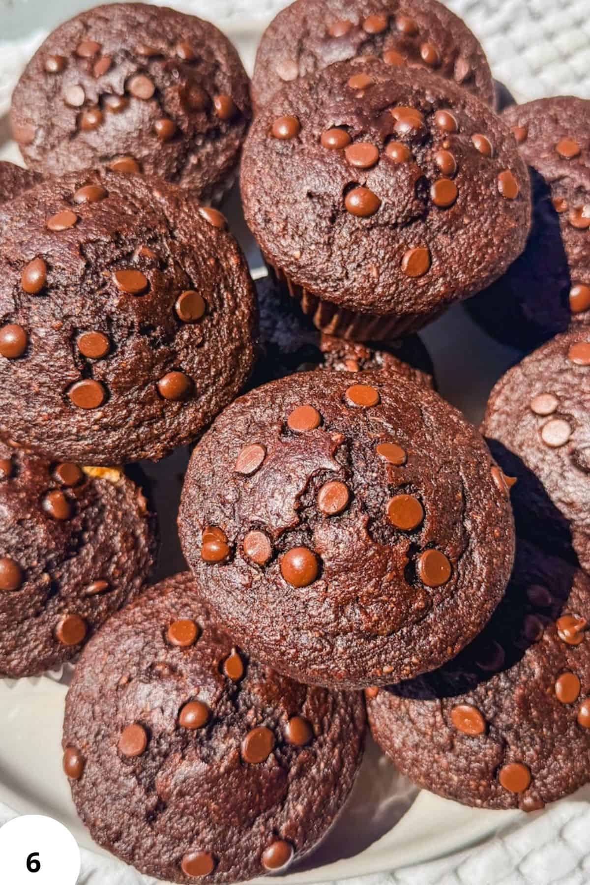 Chocolate muffins topped with chocolate sprinkles, perfect for sourdough baking.