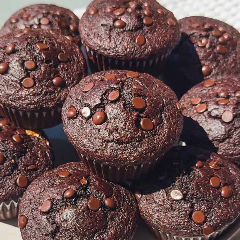 Chocolate muffins topped with chocolate chips, perfect for sourdough recipes.