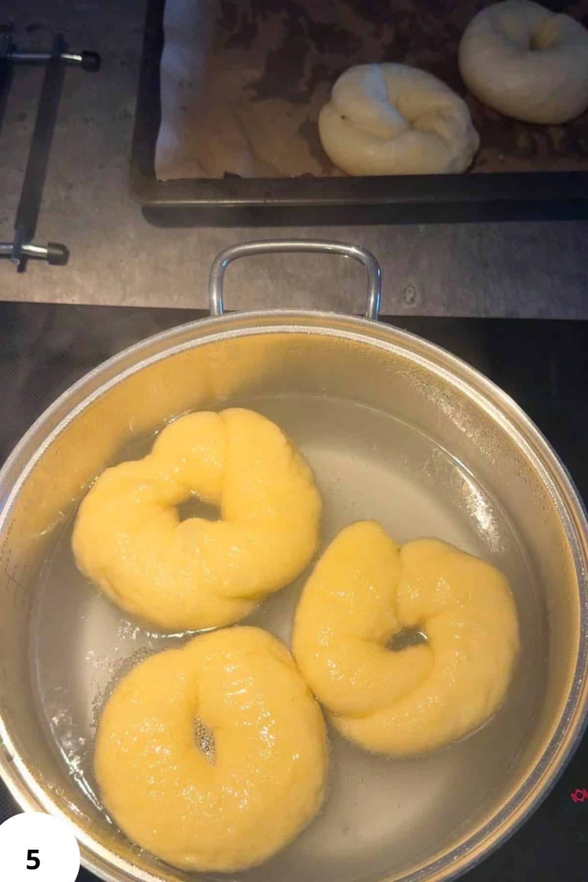 Dough balls in a pot for stretch and folds technique.
