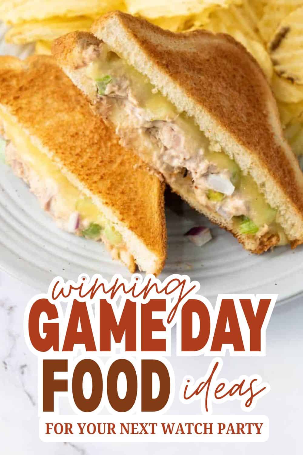 Close-up of a chicken salad sandwich on toasted bread with fresh ingredients.