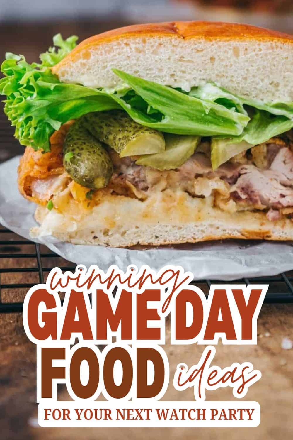 Delicious sandwich with lettuce, pickles, and meat for game day.