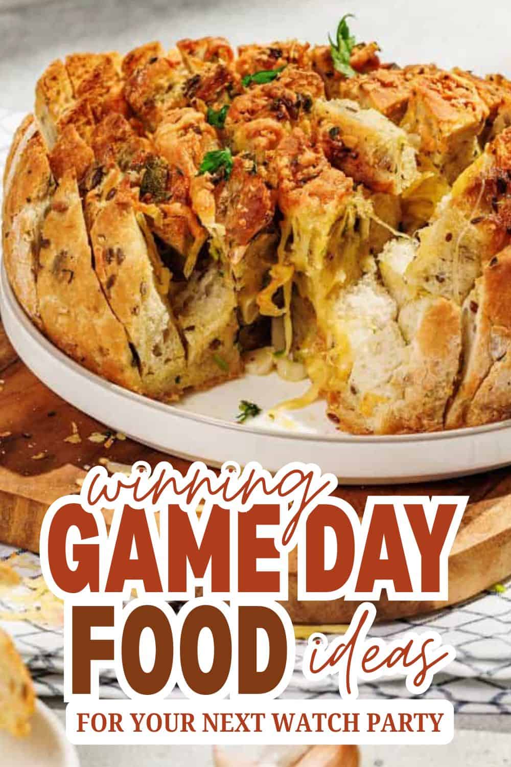 Delicious savory bread pudding with herbs and cheese, perfect for game day snacks.