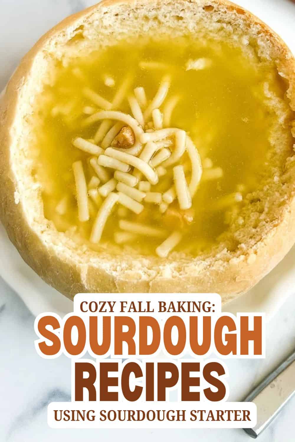 Close-up of sourdough bread bowl filled with cheese and broth, ready to serve.