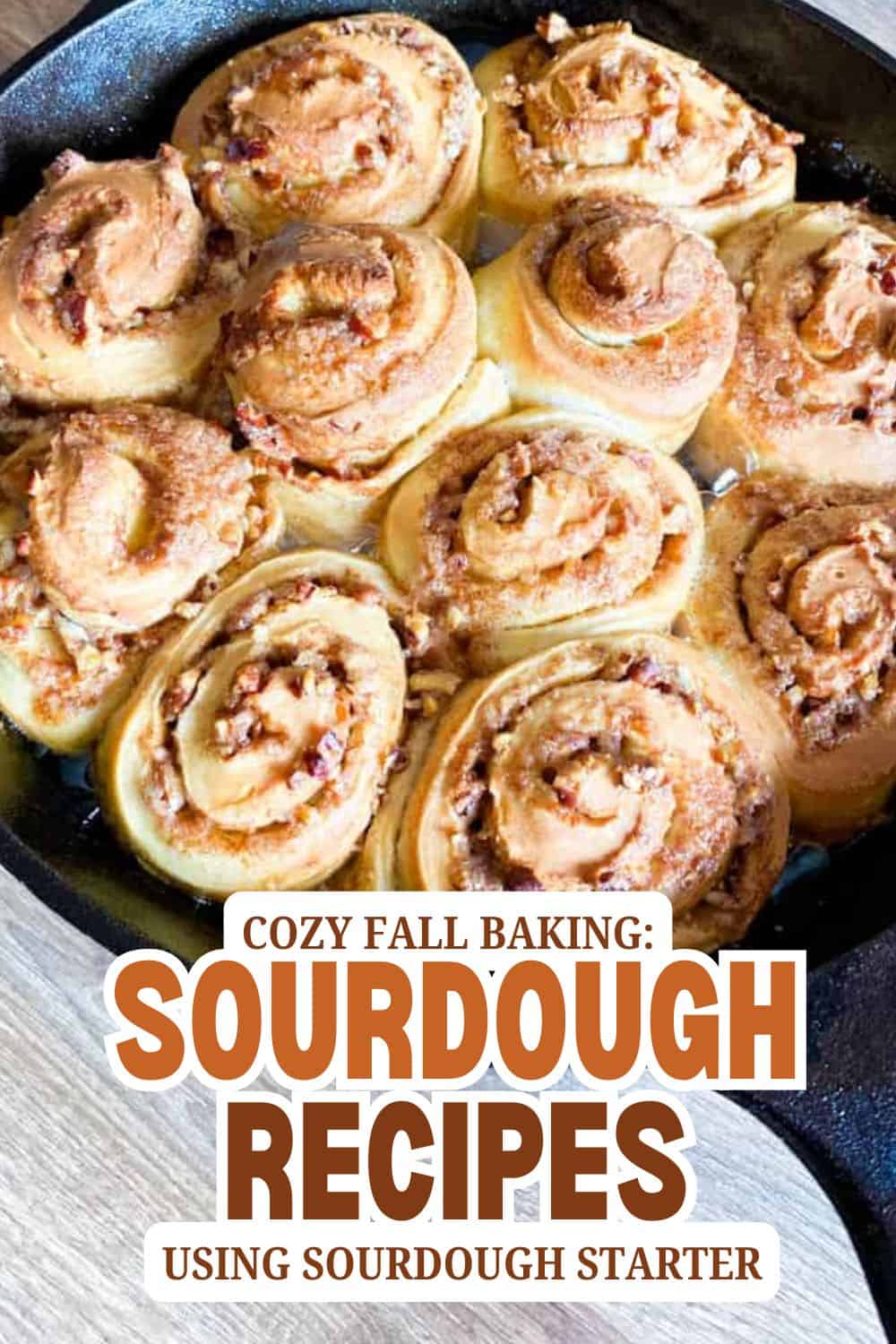 Freshly baked sourdough cinnamon rolls in a skillet, perfect for fall baking.