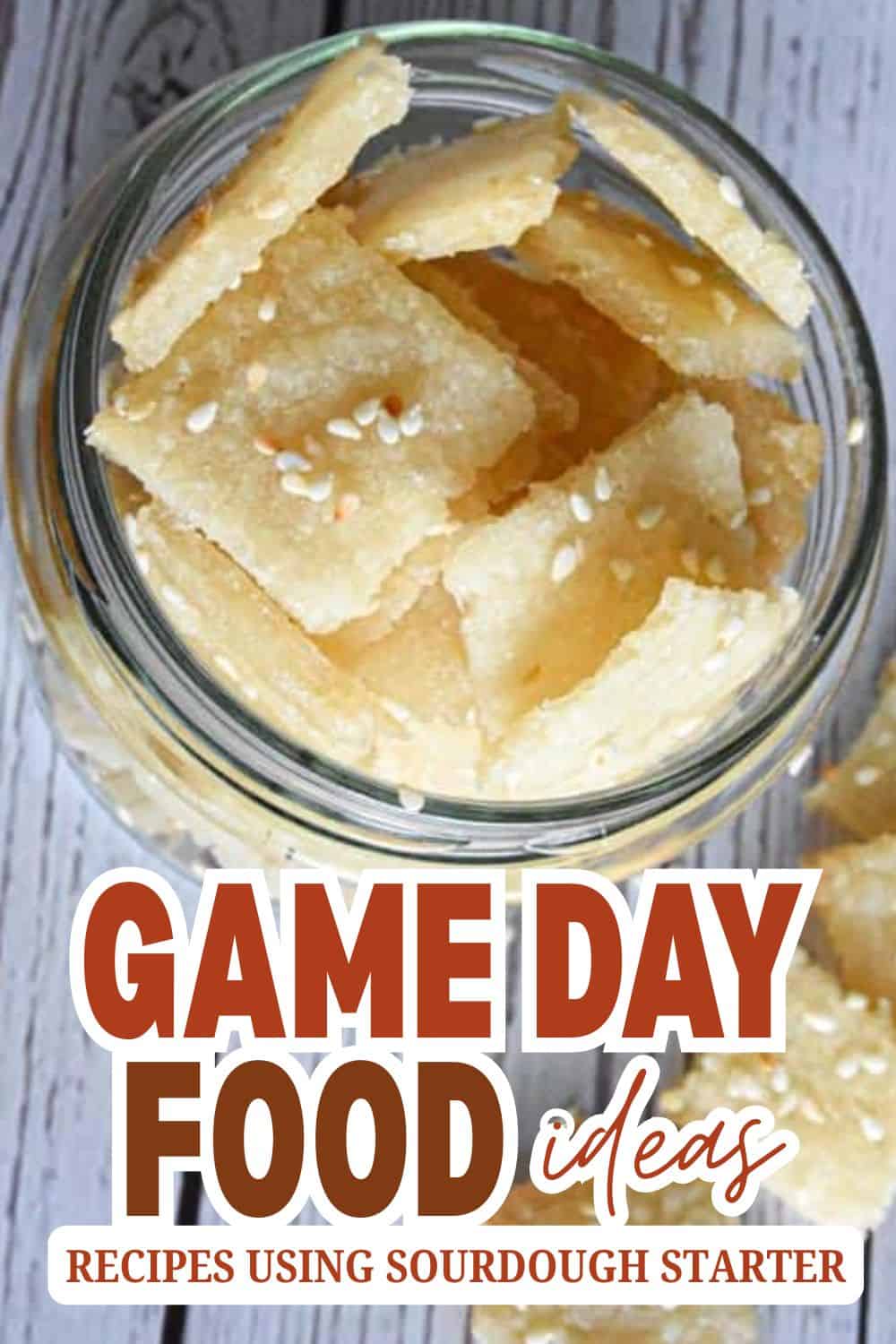 Close-up of sourdough starter crackers in a glass jar for game day food ideas.