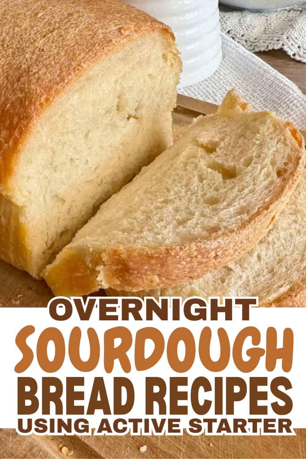 Freshly baked sourdough bread loaf with a slice cut out.