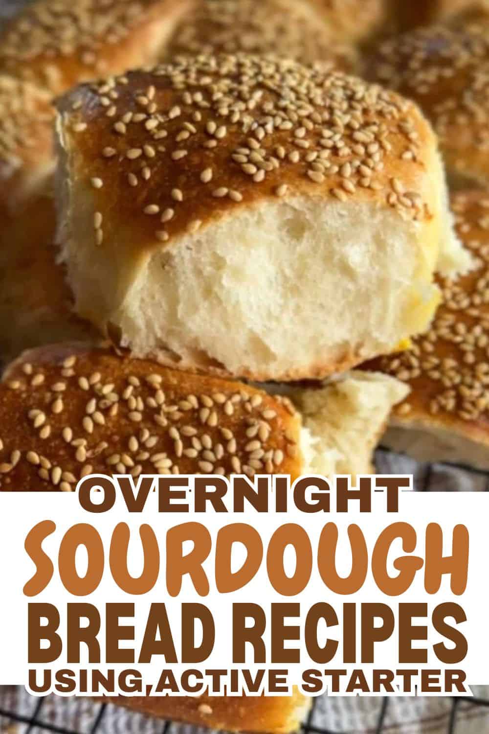 Close-up of a freshly baked sourdough bread roll with sesame seeds.