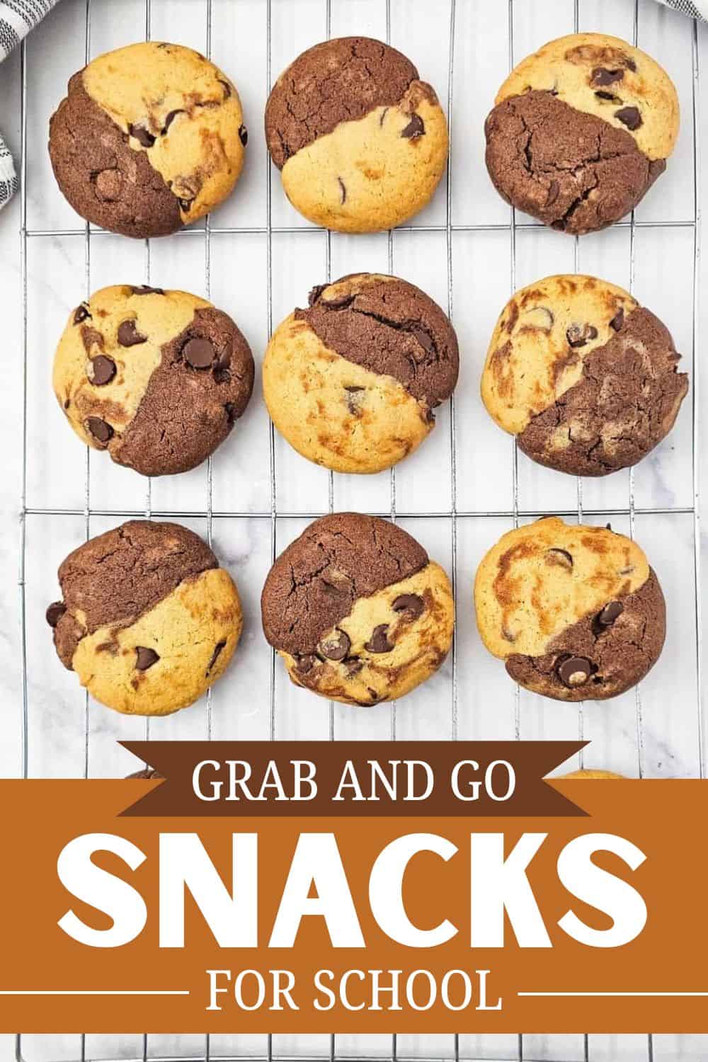 Chocolate chip and double chocolate cookies on a cooling rack.