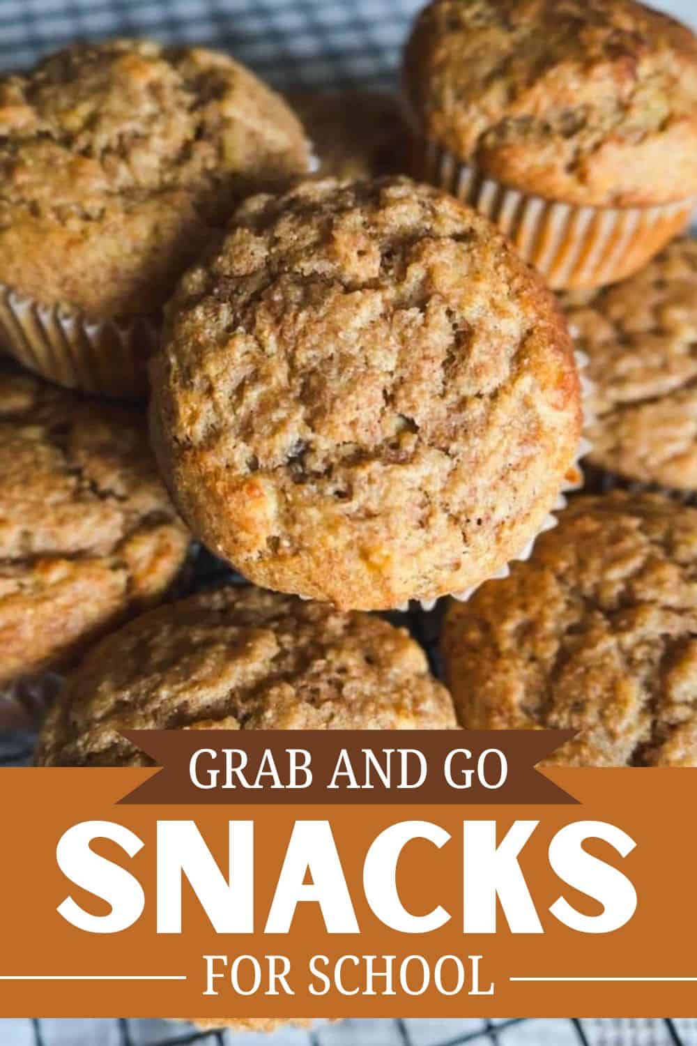 Close-up of homemade muffins with crumbly topping, perfect for snacks or breakfast.