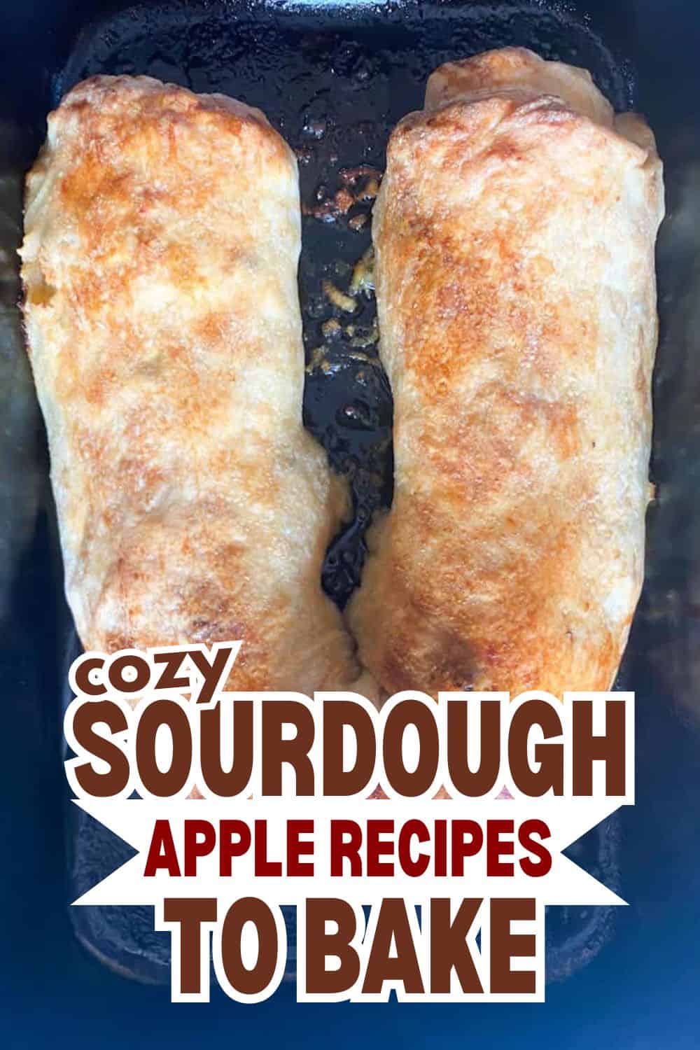 Freshly baked sourdough apple rolls on a baking tray.