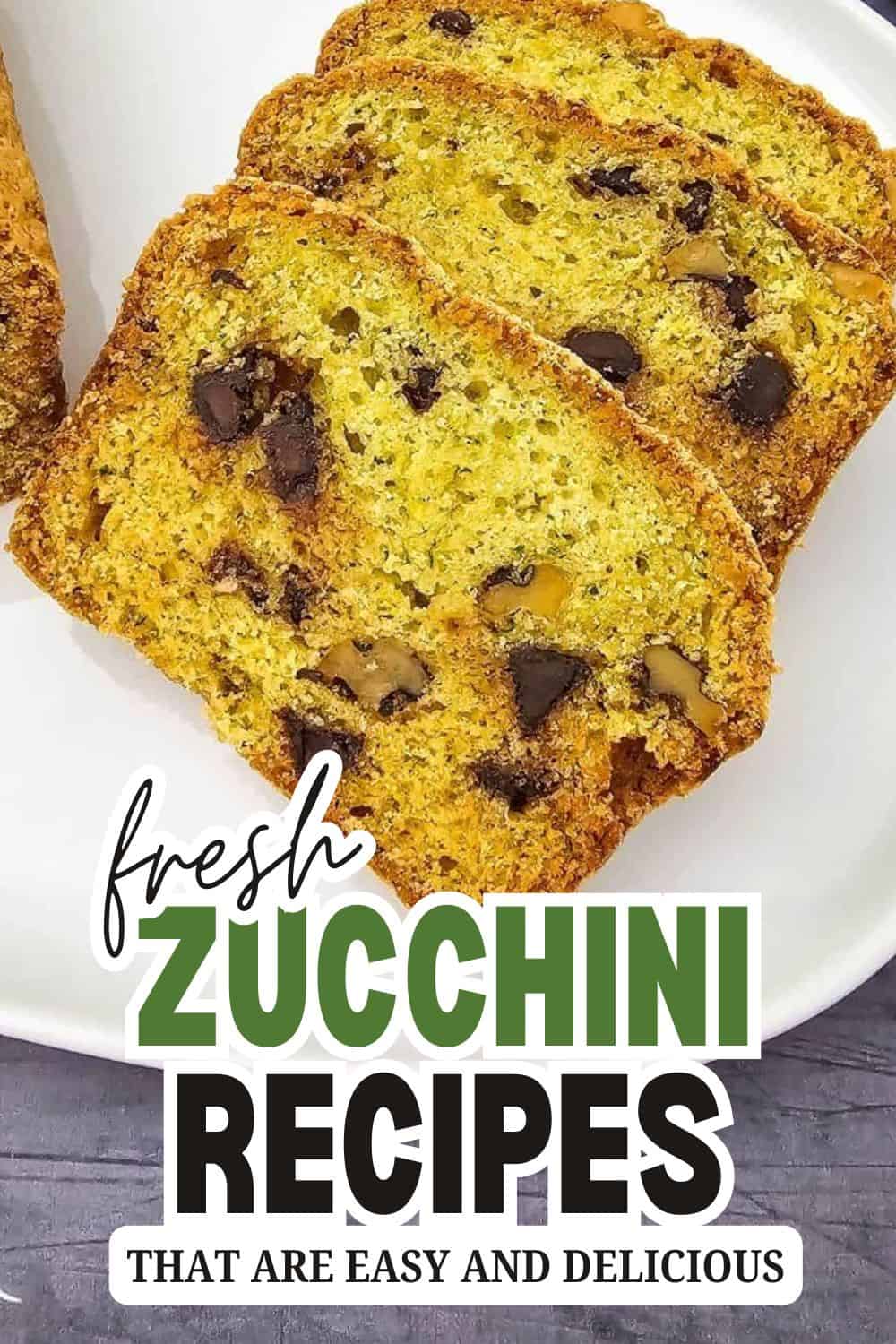 Homemade zucchini bread with chocolate chips on a white plate.