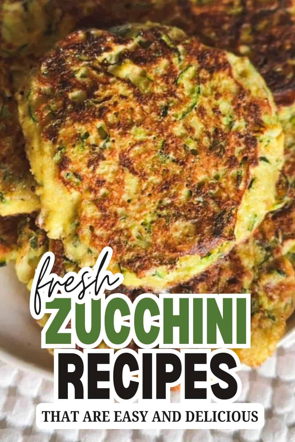 Close-up of zucchini fritters, crispy and golden brown, on a white plate.