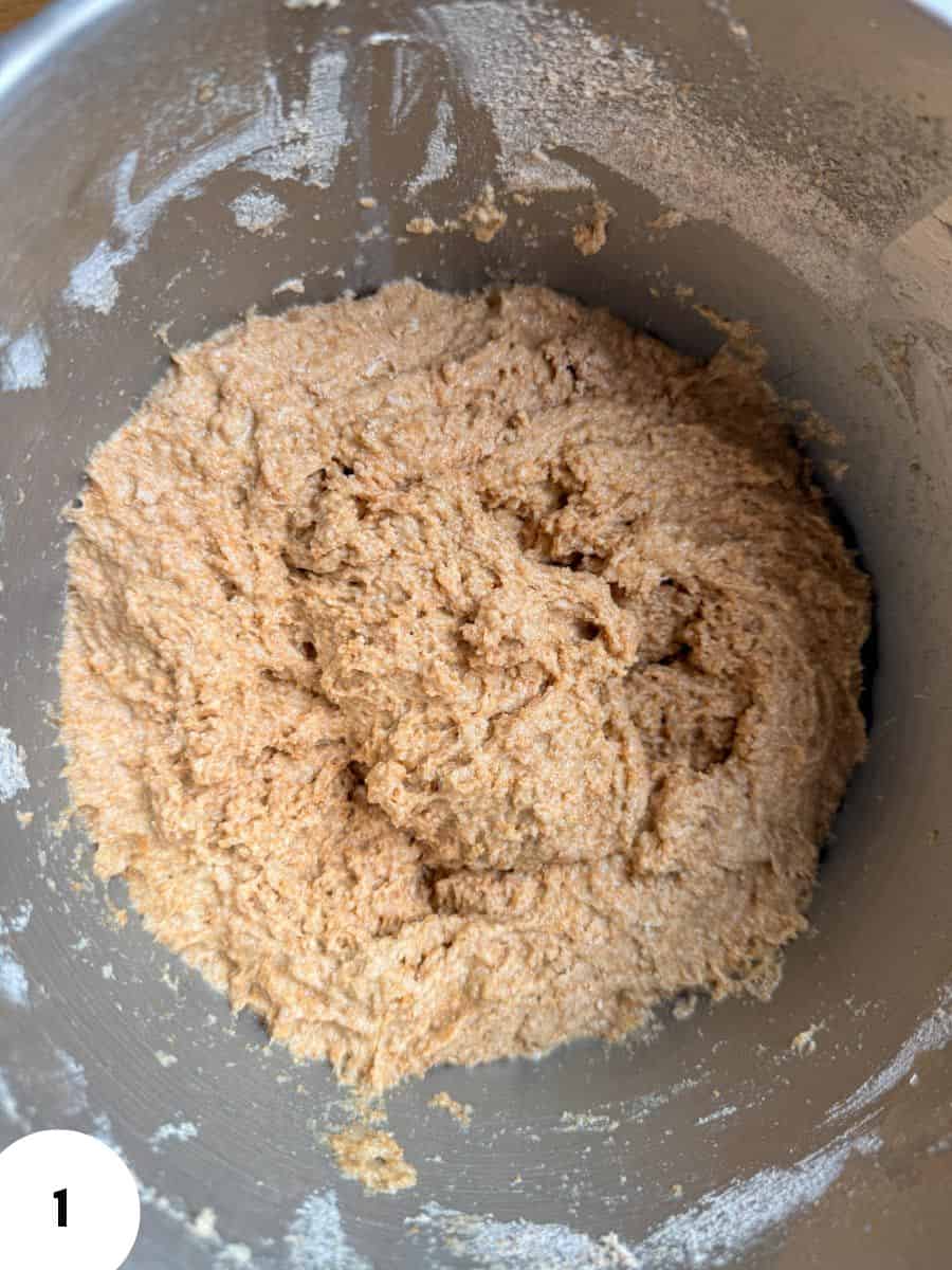 Close-up of bread dough in mixing bowl for stretch and fold technique.